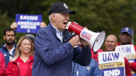 Biden urges striking auto workers to 'stick with it' in picket line visit unparalleled in history